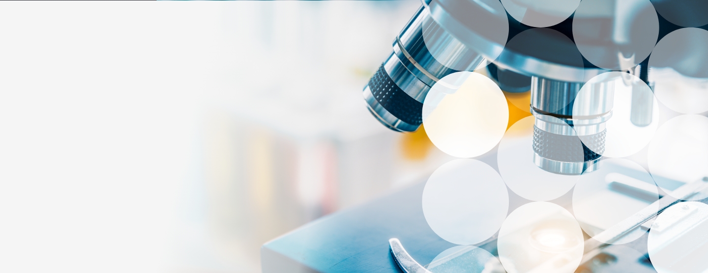 Close up of microscope with an abstract overlay of white circles in a lab setting